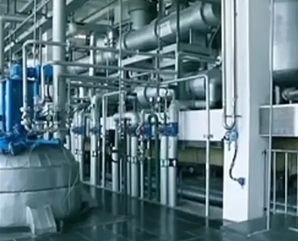 A large industrial building with pipes and valves.